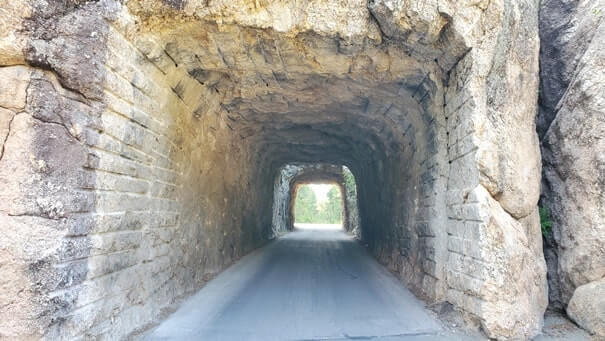 Driving through cc gideon tunnel. iron mountain road tunnel. black hills national forest. south dakota travel blog