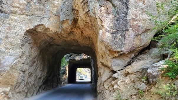Driving through cc gideon tunnel. iron mountain road. south dakota travel blog
