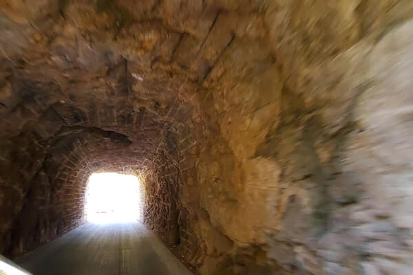 Driving through cc gideon tunnel. iron mountain road. south dakota travel blog