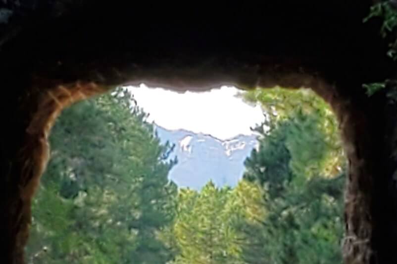 CC Gideon Tunnel view of Mount Rushmore on Iron Mountain Road. Driving through Iron Mountain Road tunnel to see Mount Rushmore. black hills national forest. south dakota travel blog