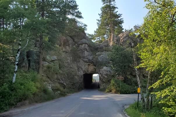driving through doane robinson tunnel iron mountain road. south dakota travel blog