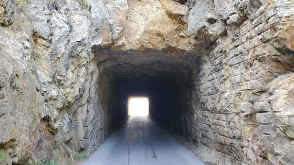 driving through doane robinson tunnel iron mountain road. south dakota travel blog