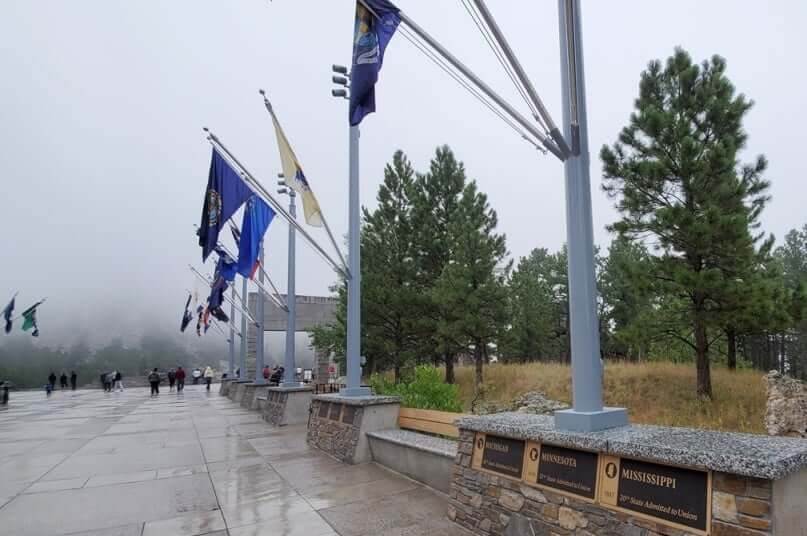 Mount Rushmore in the rain. avenue of flags. Mount rushmore weather. mount rushmore fog. south dakota travel blog