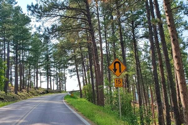 Driving iron mountain road away from scovel johnson tunnel. south dakota travel blog.