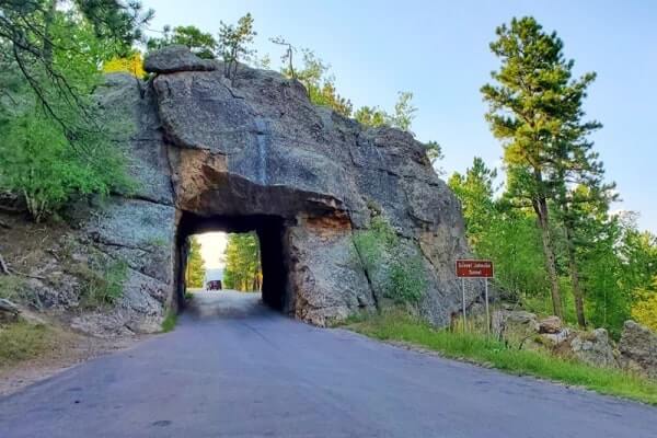 Driving through scovel johnson tunnel. iron mountain road tunnel. black hills national forest. south dakota travel blog