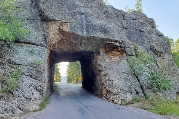 Driving through scovel johnson tunnel. iron mountain road tunnel. black hills national forest. south dakota travel blog