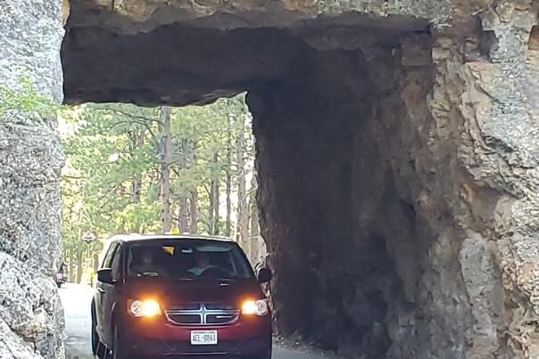 Driving through scovel johnson tunnel. iron mountain road tunnel. black hills national forest. south dakota travel blog