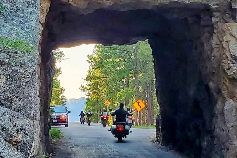 Driving through scovel johnson tunnel. iron mountain road tunnel. black hills national forest. south dakota travel blog