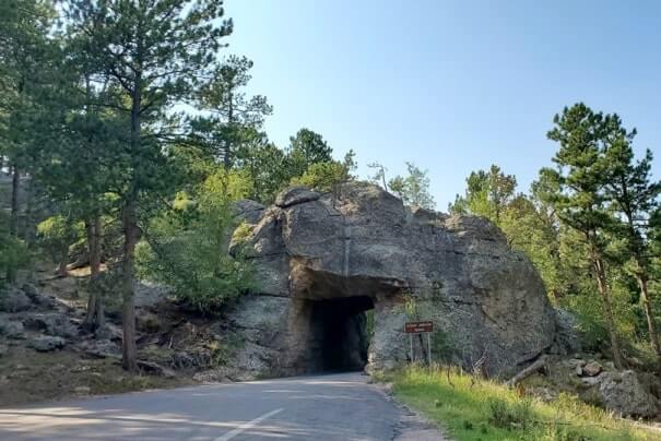 Driving through scovel johnson tunnel. iron mountain road tunnel. black hills national forest. south dakota travel blog