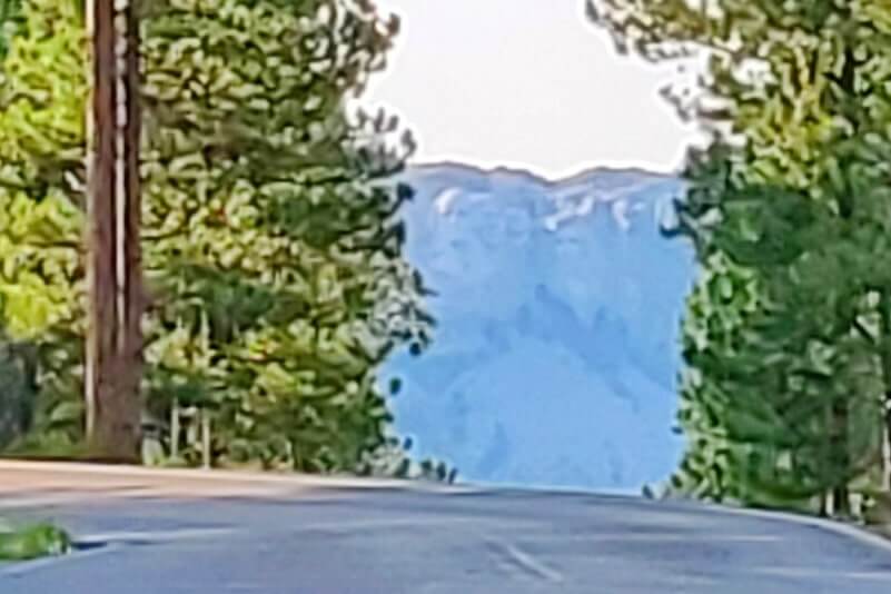 Scovel Johnson Tunnel view of Mount Rushmore on Iron Mountain Road. Driving through Iron Mountain Road tunnel to see Mount Rushmore. black hills national forest. south dakota travel blog