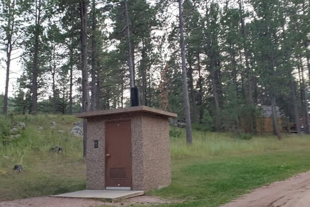 stockade lake south camping cabin without bathroom inside Custer State Park cabin. stockade lake south campground bathroom. south dakota travel blog