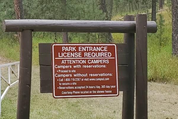 You need a custer state park pass or south dakota state park pass for stockade lake camping cabins. south dakota travel blog