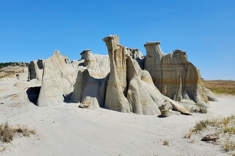 Things to do in Theodore Roosevelt National Park South Unit: hoodoos, hidden caprocks, rock formations along side of road. north dakota travel blog