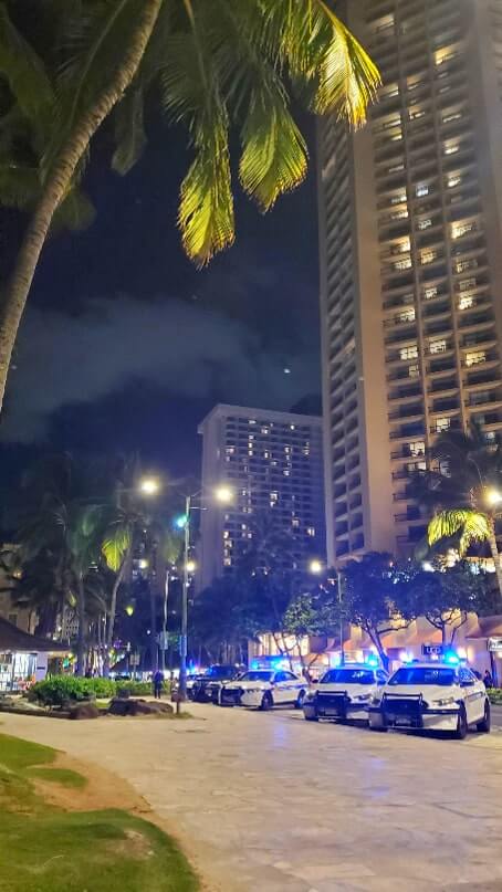 things to do in waikiki at night: waikiki police station at night. honolulu at night. oahu at night. hawaii travel blog