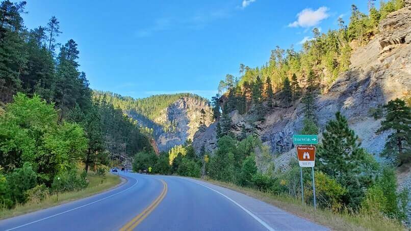 driving the spearfish canyon scenic byway to bridal veil falls in black hills national forest. south dakota