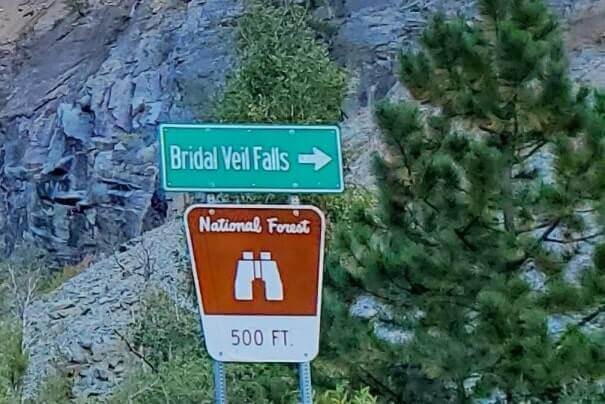 driving the spearfish canyon scenic byway to bridal veil falls in black hills national forest. south dakota