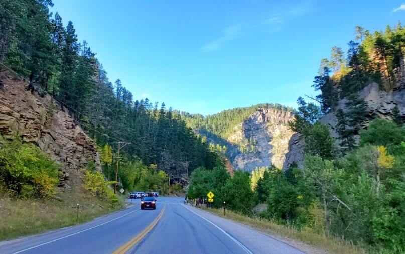 driving the spearfish canyon scenic byway to bridal veil falls in black hills national forest. south dakota