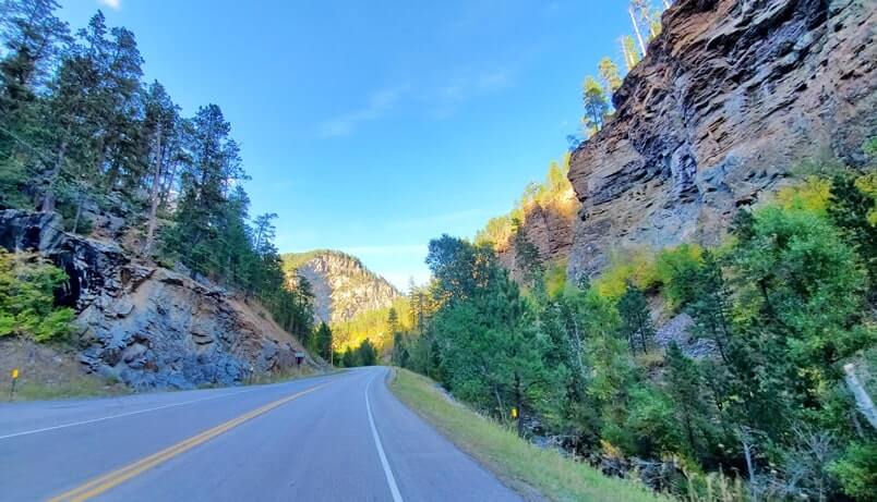driving the spearfish canyon scenic byway away from bridal veil falls in black hills national forest. south dakota