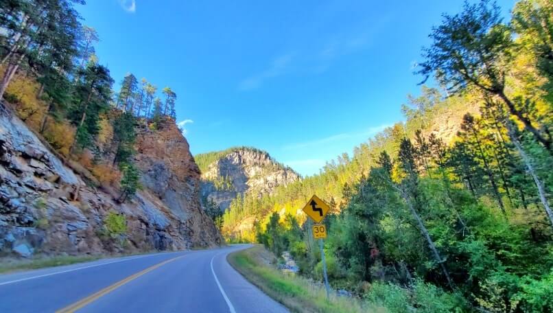 driving the spearfish canyon scenic byway away from bridal veil falls in black hills national forest. south dakota