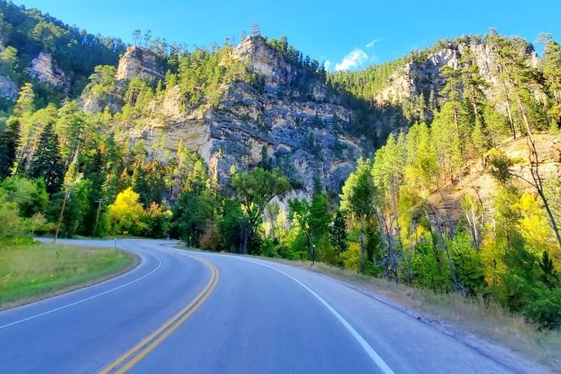 driving the spearfish canyon scenic byway away from bridal veil falls in black hills national forest. south dakota