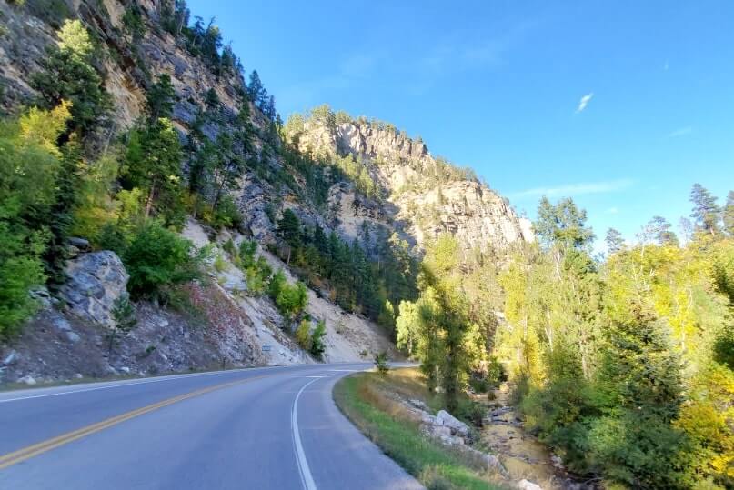 driving the spearfish canyon scenic byway away from bridal veil falls in black hills national forest. south dakota